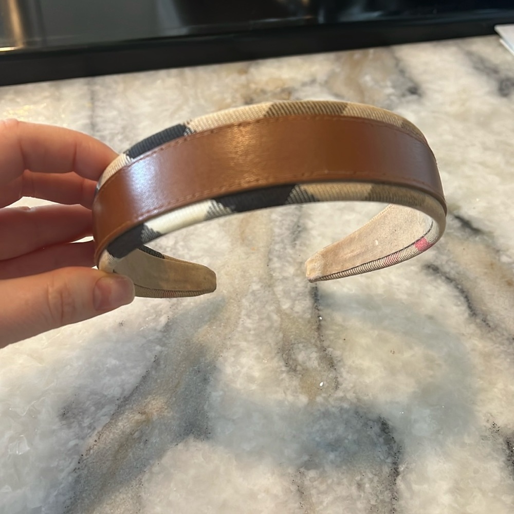 Gently used Burberry leather and fabric headband. GREAT condition.